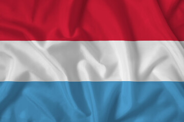 Luxembourg flag with fabric texture. Close up shot, background