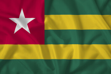 Togo flag with fabric texture. Close up shot, background