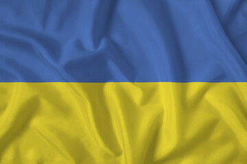 Ukraine flag with fabric texture. Close up shot, background