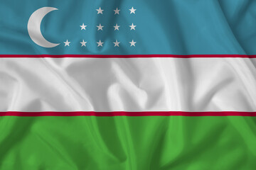 Uzbekistan flag with fabric texture. Close up shot, background