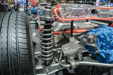 Fototapeta premium Undercarriage parts of a car, showing materials, wheels, shocks, engines