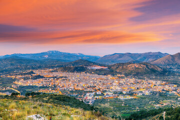 Fototapeta na wymiar Gorgeous morning cityscape of Bagheria town and national park Orientata Pizzo Cane.