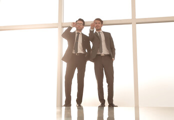 background image.two businessmen looking at copy space