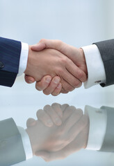handshake business partners closeup