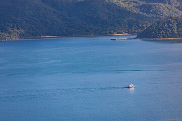 Obraz premium Speed Boat sailing across coastline, sea near Tolo Channel, Hong Kong