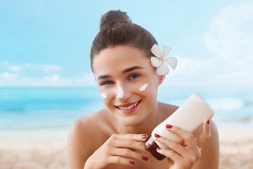 Woman smile applying sun cream  on face. Skin care. Body Sun protection. Sunscreen. - obrazy, fototapety, plakaty