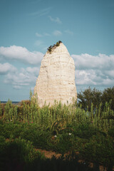 Pizzomunno, rock on the beach, Vieste, Gargano, Puglia, Italy. Imposing limestone monolith 25...