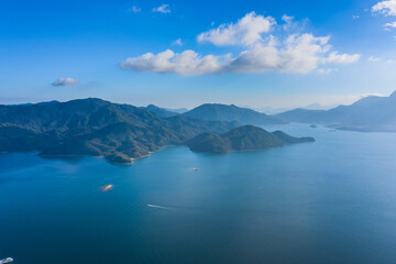 Fototapeta na wymiar Ships sailing across coast of natural landscape, Near Tolo Channel, Hong Kong