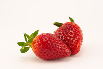 Two juicy and fresh strawberries up close