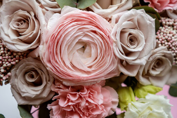 Bright pink flowers bouquet closeup. Roses and orchids wallpaper. Beautiful background for a Birthday, International Female Day, or Saint Valentine. The festive backdrop for a postcard design