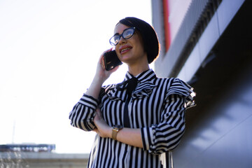 Business woman having a important call outside