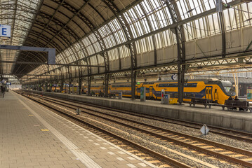 Fototapeta na wymiar Amsterdam, Netherlands, March 2022. The busy central station in Amsterdam, the Netherlands.