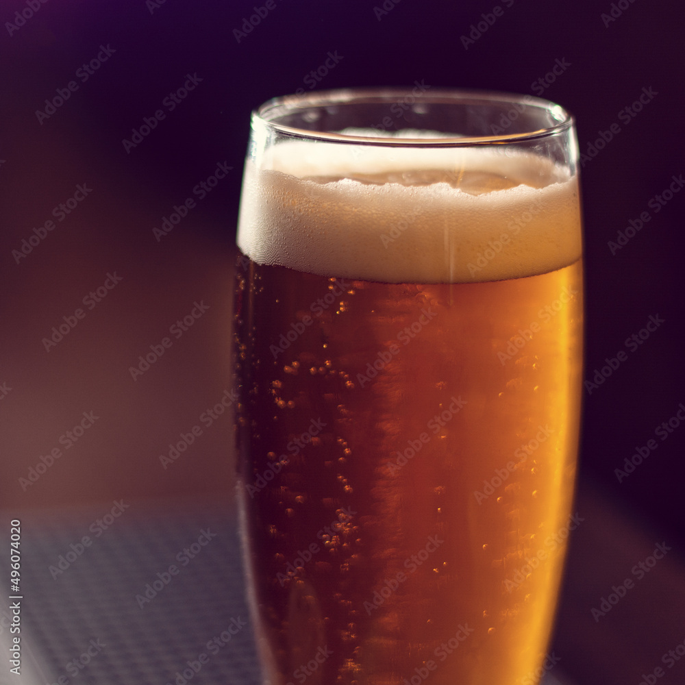 Sticker glass of beer close up on wooden table square