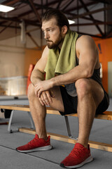 Fototapeta premium tired man after workout in the gym