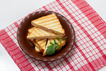 Homemade grilled cheese sandwich for breakfast on plate.