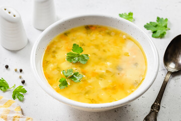 Roasted summer squash yellow vegetable soup. Top view, copy space.