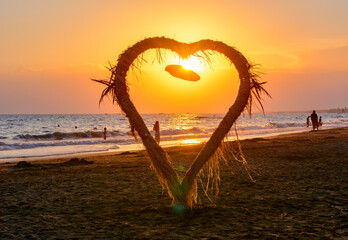 Naklejka premium Heart model on a beach at sunset, Side, Turkey