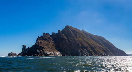View of the Cape of Good Hope and the lighthouse complex from the sea.