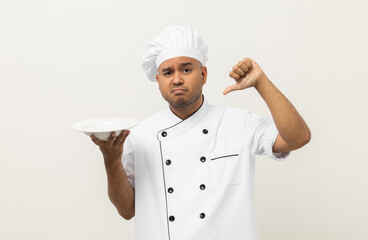 Bad smell and not tasty food. Young asian master chef holding dish has rotten food dishes smelly and disgusting. Dirty food with chef on isolated background.