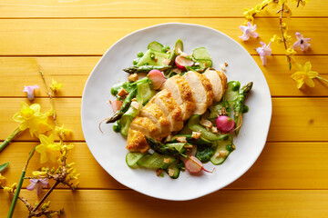 Tasty chicken breast with vegetable salad on plate