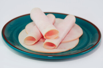 Thinly sliced pieces of meat sausage ham