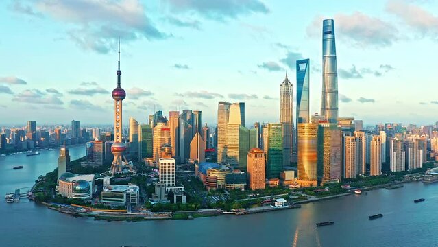 Aerial footage of modern commercial buildings and skyline in Shanghai at sunset, China. World famous city skyline in Shanghai.