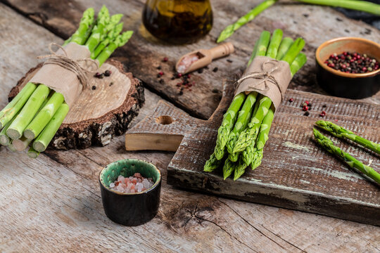 Asparagus. bunch of fresh asparagus. banches of fresh green asparagus on dark background, Pickled Green Asparagus. Close up. Long banner format