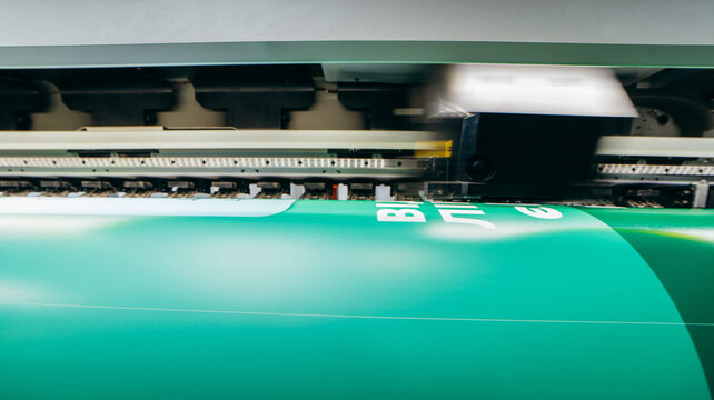 Graphic design and  advertising concept. Large format plotter, close up