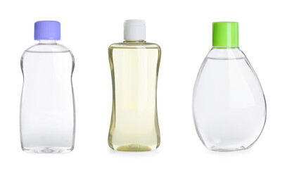 Set with bottles of baby oil on white background