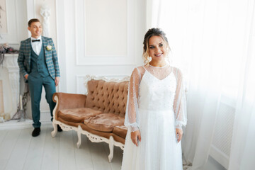 Stylish happy newlyweds, elegant satisfied bride. Newlyweds gathering