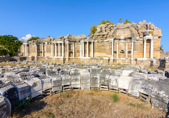 Fototapeta premium Ruins of Monumental Fountain (Nymphaeum) in ancient Side, Antalya, Turkey