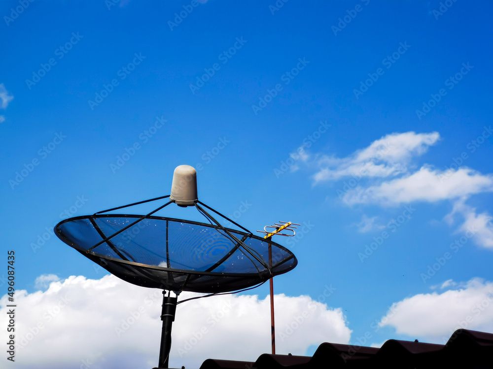 Wall mural a picture of the daytime sky with clouds and a tv satellite dish.