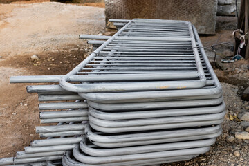 Metal fences are folded at the construction site, prepared for installation. Pirila for...