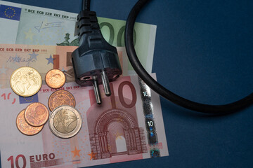 Power cable.EU type F plug lies on euro banknotes.The concept of rising energy prices.Energy war. Saving home budget.