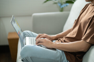 Naklejka premium Man work from home. work online on laptop. Asian businessman working online business concept with social distancing laptop online meeting.