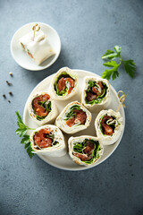 Homemade salmon wraps with fresh salad