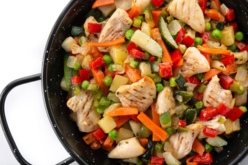 Chicken stir fry and vegetables isolated on white background.Close up