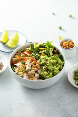 Healthy bowl with chicken and avocado