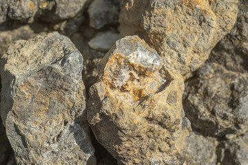 Geode with Quartz crystals in stone, close-up. Raw quartz in a mine in stone.