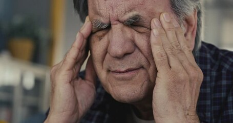 Man with headache close up view
