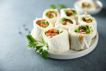 Homemade salmon wraps with fresh salad