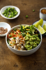 Healthy bowl with chicken and avocado