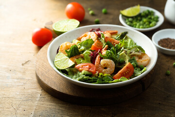 Healthy green salad with shrimps and avocado