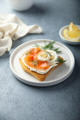 Salmon toast with quail eggs and dill