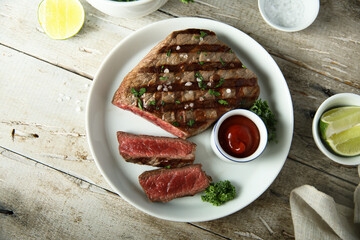 Grilled beef steak with tomato sauce	