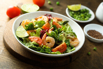 Healthy green salad with shrimps and avocado