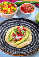 Mexican tortilla with prawns and avocado and salsa