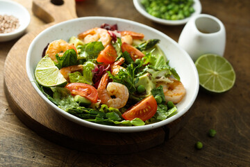 Healthy green salad with shrimps and avocado