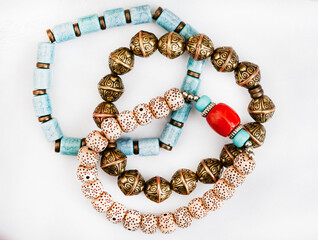 Boho style bracelets on white background