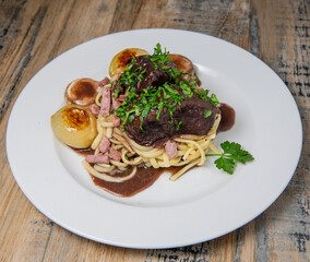 Traditional beef bourgignon recipe, beef cooked with spaghetti and mushroom, High quality photo